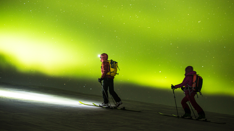 McKenna Peterson and Sam Cohen with the Northern Lights