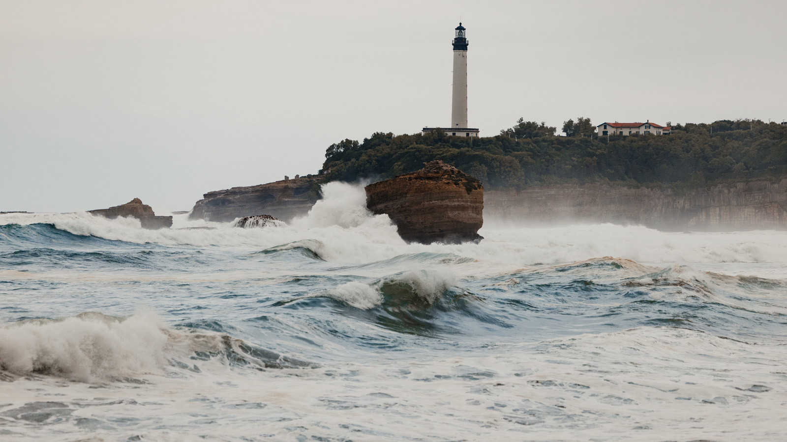 Le Grand Phare from Biarritz surrounded by waves
