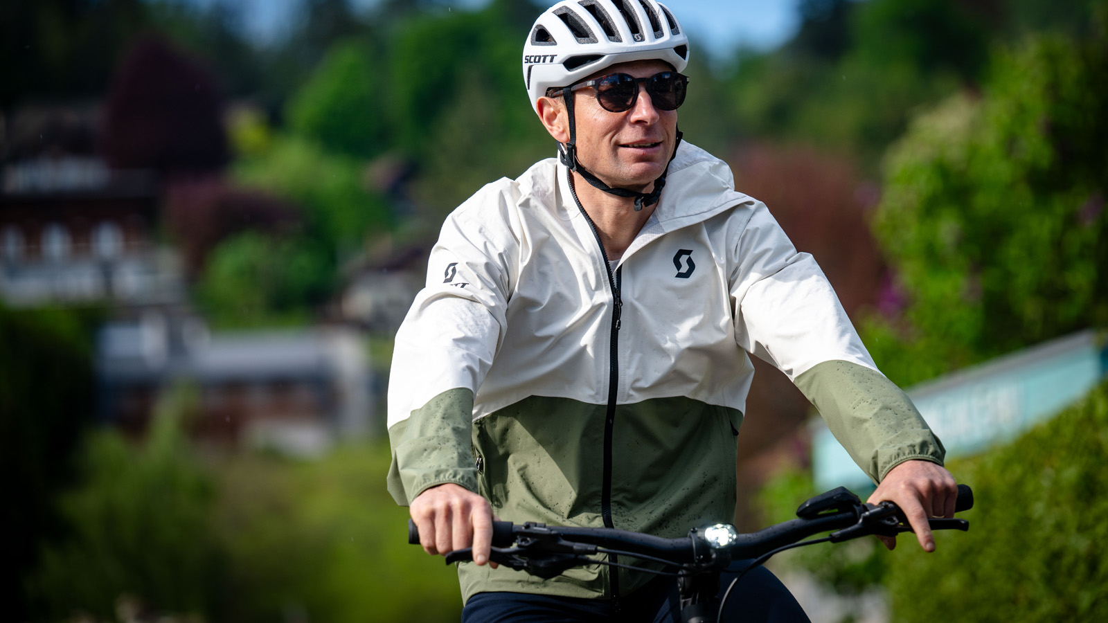 Michelin-starred chef Jean Sulpice riding SCOTT Bike while wearing a branded SCOTT white helmet