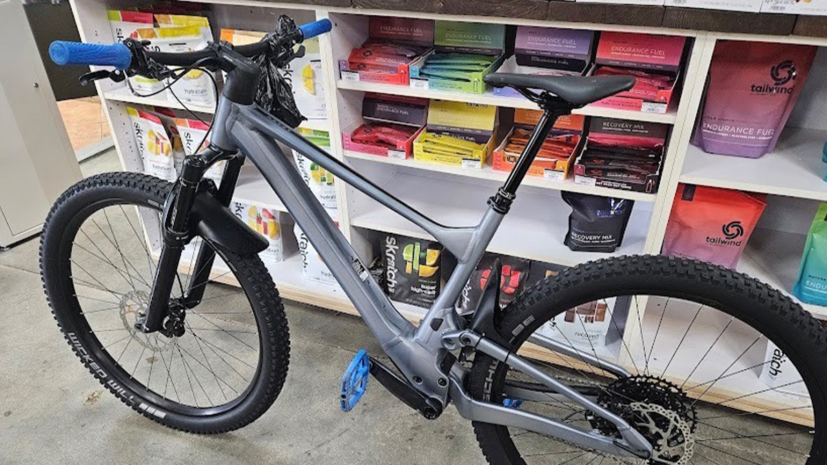 A SCOTT Spark 920 TR bike in front of a nutrition display at Alex's Bicycle Pro Shop in Weston, Florida.