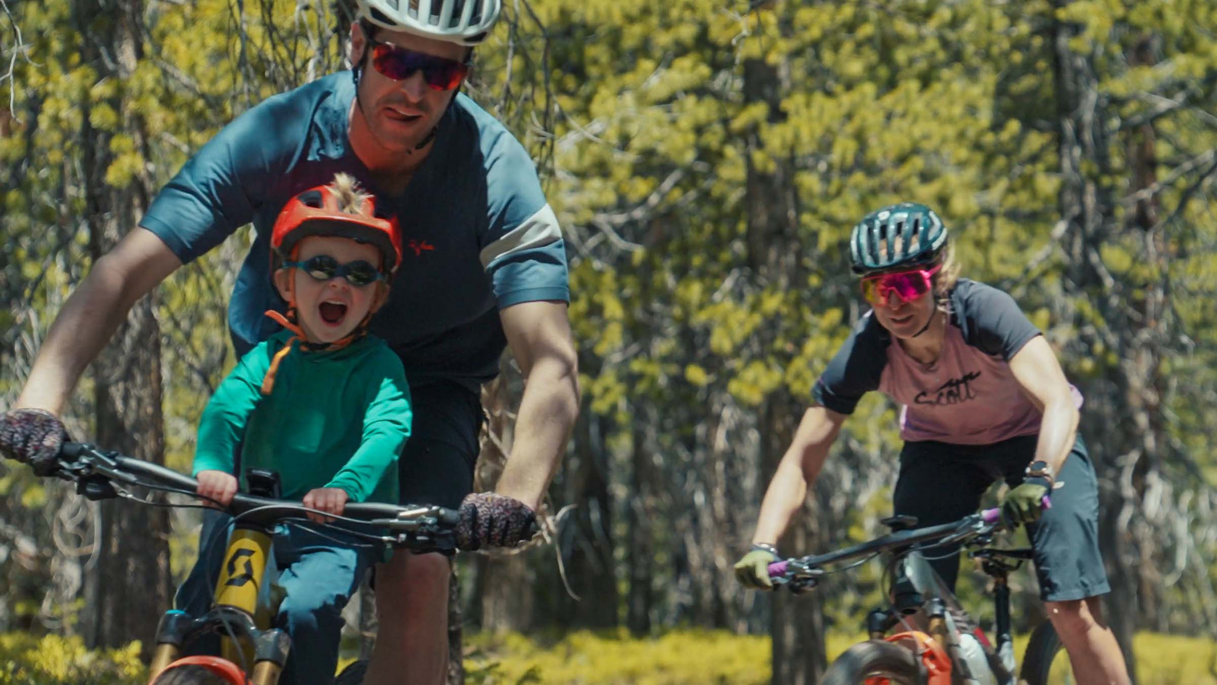 Brennan Huck, with his parents Andrew and Erin Huck, enjoying the bike adventure with his family.
