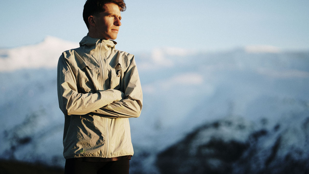 Men's lightweight beige windbreaker jacket for hiking and outdoor adventures in the mountains.