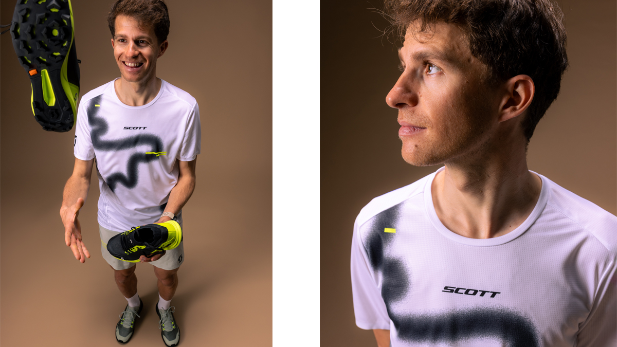 Man wearing a Scott RC Run short sleeve tee in white and black with athletic trail running design.