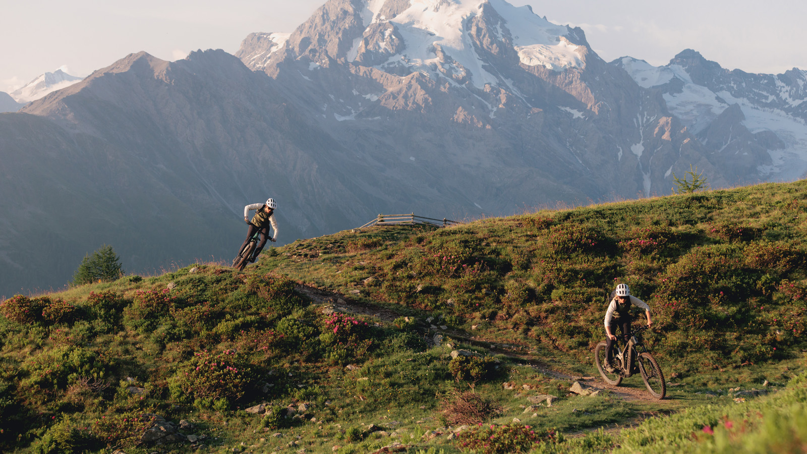 Two women Mountain Biking in mountains landscape