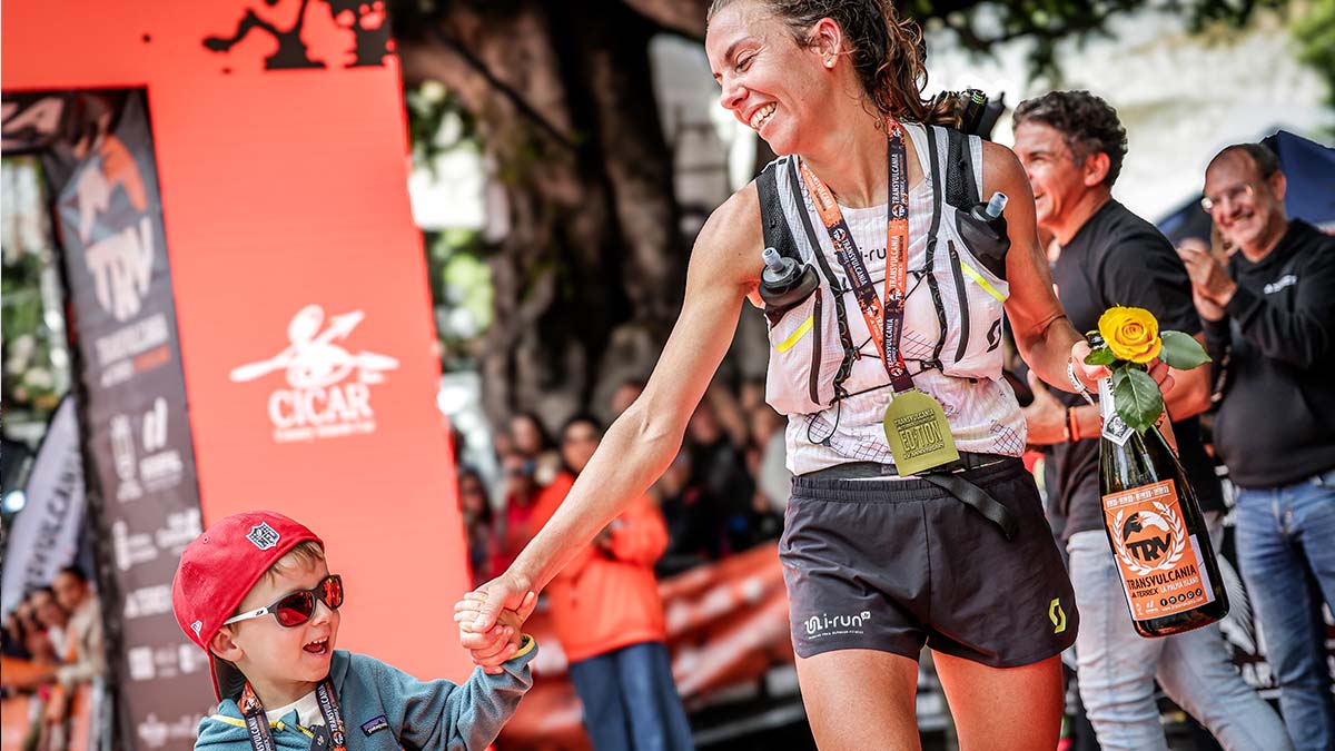 Anne-Lise celebrates with her family at the finish line. Photos by Cyrille Quintard
