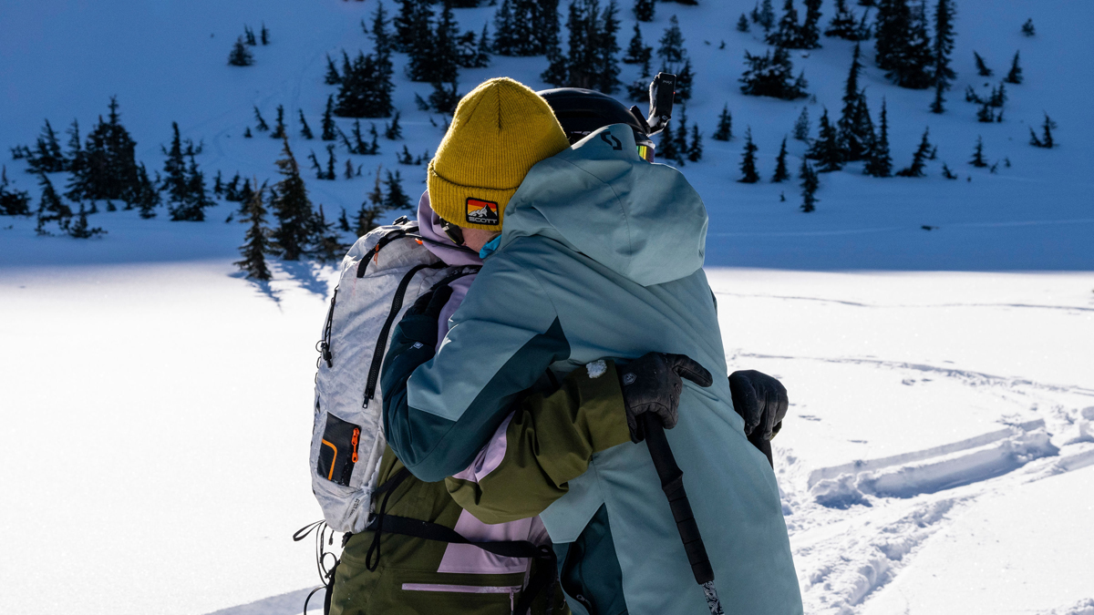 Molly Armanino and McKenna Peterson in Slopes of Change, sharing a tender moment