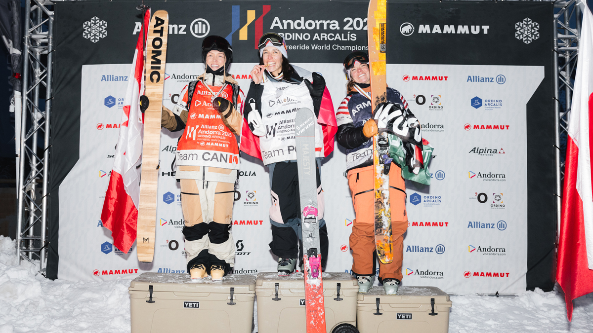 Zuzanna Witych on a prodium wearing ski gears and biting in a medal