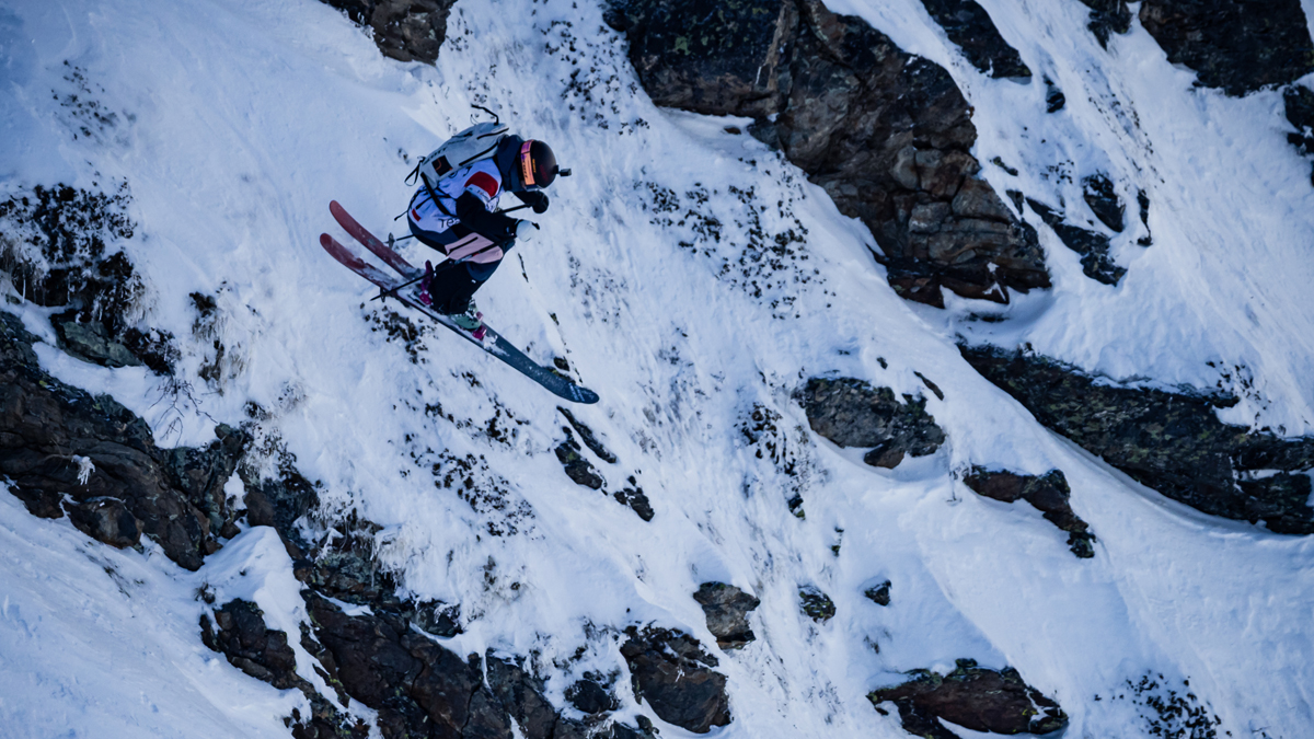 Zuzanna Witych jumping a big rock during a freeride competition
